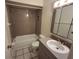 Clean bathroom with a shower/tub combo and updated vanity at 2672 Arjay Ct, Palm Harbor, FL 34684