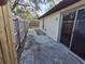 Private backyard with a patio and wooden fence at 2672 Arjay Ct, Palm Harbor, FL 34684