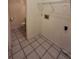 Functional laundry room with shelving and access to a toilet at 2672 Arjay Ct, Palm Harbor, FL 34684