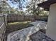 Fenced backyard, featuring a patio area and open space at 2672 Arjay Ct, Palm Harbor, FL 34684
