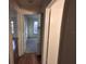 Bright hallway with wood flooring and access to bedrooms at 2672 Arjay Ct, Palm Harbor, FL 34684