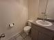 Simple bathroom with a toilet and vanity at 2672 Arjay Ct, Palm Harbor, FL 34684