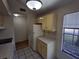 Efficient kitchen featuring white appliances and ample cabinet space at 2672 Arjay Ct, Palm Harbor, FL 34684