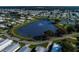 Aerial view of community with pond and fountain at 36651 Jodi Ave, Zephyrhills, FL 33542