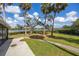 Expansive backyard with lush greenery, mature trees, and river views at 505 S 56Th St, Tampa, FL 33619