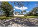 Single-story home with driveway and lush landscaping at 505 S 56Th St, Tampa, FL 33619