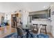 Bright dining area with four chairs and a modern round table at 5222 Olmstead Bay Pl, Tampa, FL 33611