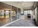 Outdoor kitchen with stainless steel appliances and sliding glass doors at 8018 Clementine Ln, Tampa, FL 33625