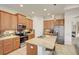 Modern kitchen with stainless steel appliances and granite countertops at 1804 Pacific Dunes Dr, Sun City Center, FL 33573
