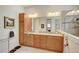 Elegant bathroom with dual vanity, granite countertops, and a large shower at 1804 Pacific Dunes Dr, Sun City Center, FL 33573
