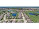 Aerial view of a residential neighborhood with a golf course nearby at 1804 Pacific Dunes Dr, Sun City Center, FL 33573