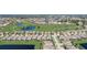 Aerial view of a residential neighborhood with a golf course nearby at 1804 Pacific Dunes Dr, Sun City Center, FL 33573