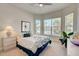 Spacious bedroom with bay windows and ceiling fan at 1804 Pacific Dunes Dr, Sun City Center, FL 33573