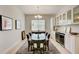 Elegant dining room with a glass-top table and built-in cabinetry at 1804 Pacific Dunes Dr, Sun City Center, FL 33573