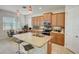 Island kitchen with stainless steel appliances and breakfast bar at 1804 Pacific Dunes Dr, Sun City Center, FL 33573