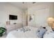 Bright bedroom with a queen-size bed, dresser, and large closet at 1804 Pacific Dunes Dr, Sun City Center, FL 33573