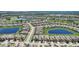 Aerial view of a luxury community with lakes and lush landscaping at 1804 Pacific Dunes Dr, Sun City Center, FL 33573
