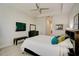 Grand main bedroom, featuring a king-size bed and a large TV at 1804 Pacific Dunes Dr, Sun City Center, FL 33573