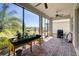 Relaxing screened patio with brick flooring and backyard views at 1804 Pacific Dunes Dr, Sun City Center, FL 33573