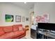 Bright office with a sofa, providing a comfortable workspace at 1804 Pacific Dunes Dr, Sun City Center, FL 33573