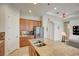 Kitchen boasts granite counters, stainless steel appliances, and an island at 1804 Pacific Dunes Dr, Sun City Center, FL 33573