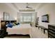 Spacious main bedroom with king-size bed and sitting area at 1804 Pacific Dunes Dr, Sun City Center, FL 33573