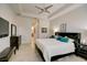 Luxurious main bedroom with king-size bed and ensuite bathroom access at 1804 Pacific Dunes Dr, Sun City Center, FL 33573