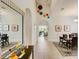 Bright and spacious hallway with a view into the living room and dining area at 1804 Pacific Dunes Dr, Sun City Center, FL 33573