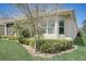 Landscaped backyard with well-maintained lawn and hedges at 1804 Pacific Dunes Dr, Sun City Center, FL 33573