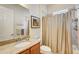 Clean bathroom with shower/tub combo and granite vanity at 1804 Pacific Dunes Dr, Sun City Center, FL 33573