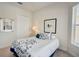 Cozy bedroom featuring a full-size bed and ample natural light at 1804 Pacific Dunes Dr, Sun City Center, FL 33573