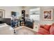Home office features built-in shelving and comfortable seating at 1804 Pacific Dunes Dr, Sun City Center, FL 33573