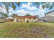 Large backyard with grassy area and partially fenced at 4220 W Bay View Ave, Tampa, FL 33611