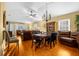 Bright dining room with hardwood floors, chandelier, and built-in hutch at 6703 Pistachio St, Zephyrhills, FL 33542