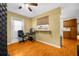 Efficient kitchenette with breakfast bar and wood flooring at 6703 Pistachio St, Zephyrhills, FL 33542