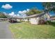 Exterior of home with carport and landscaped yard at 6703 Pistachio St, Zephyrhills, FL 33542