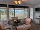 Cozy dining area with water views and glass-top table at 1009 Cherry Hills Dr, Sun City Center, FL 33573