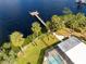 Waterfront property with pool, dock, and lush landscaping at 505 S 56Th St, Tampa, FL 33619