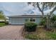 Light teal house exterior with mature landscaping at 2607 Lancaster Dr # 35, Sun City Center, FL 33573