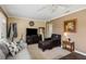 Cozy living room with gray sofa and leather chair at 1001 57Th N Ave, St Petersburg, FL 33703