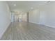 Spacious living room with grey wood-look floors at 2010 1/2 E Wood St # St, Tampa, FL 33604