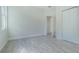 Bright bedroom with wood-look floors and double door closet at 2010 1/2 E Wood St # St, Tampa, FL 33604