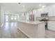 Modern kitchen with white cabinets and granite island at 2010 1/2 E Wood St # St, Tampa, FL 33604
