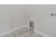 Laundry room with built-in utility space and vinyl flooring at 2010 1/2 E Wood St # St, Tampa, FL 33604