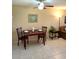 Cozy dining space featuring tile floors, a ceiling fan, and natural light at 2390 Shelly Dr # D, Palm Harbor, FL 34684