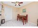 Bright dining area with a ceiling fan and cozy table setting next to the kitchen at 2390 Shelly Dr # D, Palm Harbor, FL 34684