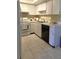 Efficient kitchen with ample cabinets and countertop space at 2390 Shelly Dr # D, Palm Harbor, FL 34684