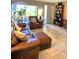 Comfortable living room with leather furniture, natural light, and bookshelf at 2390 Shelly Dr # D, Palm Harbor, FL 34684