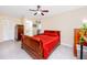 Inviting bedroom with ceiling fan, tile flooring and ample closet space at 2390 Shelly Dr # D, Palm Harbor, FL 34684
