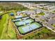 Aerial view of community tennis courts at 32176 Rosewood Meadow Ln, Wesley Chapel, FL 33543